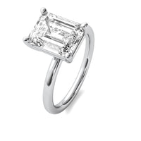 High Set Emerald Solitaire Diamond Ring