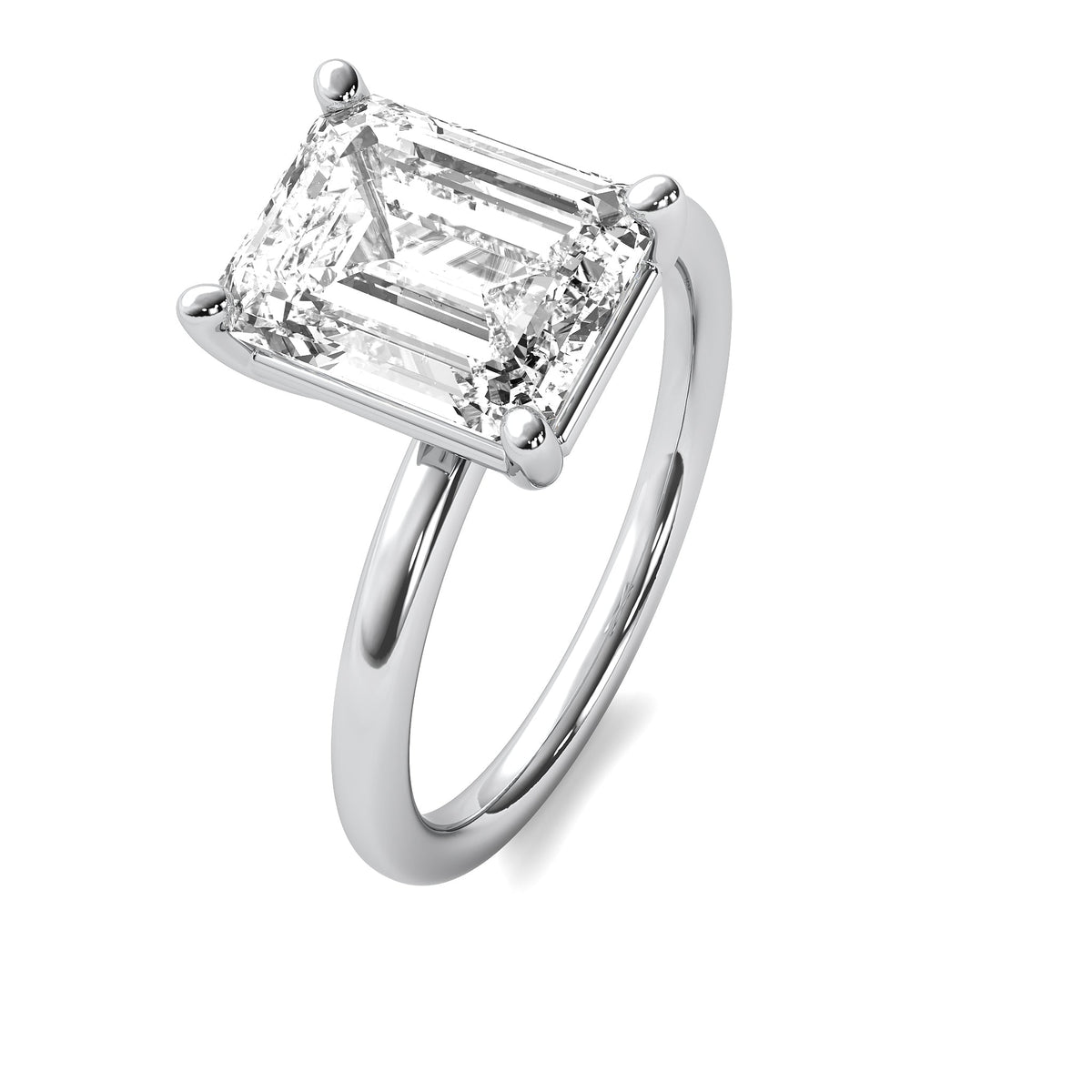 High Set Emerald Solitaire Diamond Ring