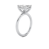 High Set Emerald Solitaire Diamond Ring