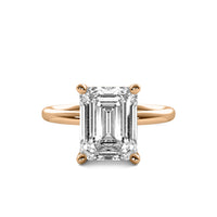 High Set Emerald Solitaire Diamond Ring