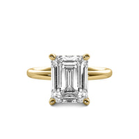 High Set Emerald Solitaire Diamond Ring