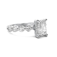 Evadne Emerald Solitaire with Hidden Halo and Half Round Accent Stones