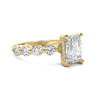 Evadne Emerald Solitaire with Hidden Halo and Half Round Accent Stones