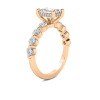 Evadne Emerald Solitaire with Hidden Halo and Half Round Accent Stones