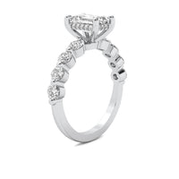 Evadne Emerald Solitaire with Hidden Halo and Half Round Accent Stones
