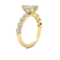 Evadne Emerald Solitaire with Hidden Halo and Half Round Accent Stones