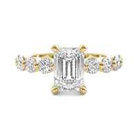 Evadne Emerald Solitaire with Hidden Halo and Half Round Accent Stones