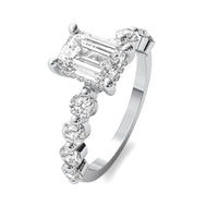 Evadne Emerald Solitaire with Hidden Halo and Half Round Accent Stones