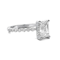 Evadne Emerald Solitaire with Hidden Halo and Half Round Accent Stones