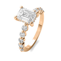 Evadne Emerald Solitaire with Hidden Halo and Half Round Accent Stones