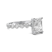 Evadne Emerald Solitaire with Hidden Halo and Half Round Accent Stones