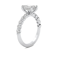 Evadne Emerald Solitaire with Hidden Halo and Half Round Accent Stones