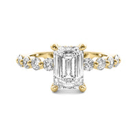 Evadne Emerald Solitaire with Hidden Halo and Half Round Accent Stones
