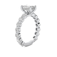 Evadne Emerald Solitaire with Hidden Halo and Full Round Accent Stones