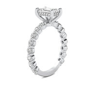 Evadne Emerald Solitaire with Hidden Halo and Full Round Accent Stones